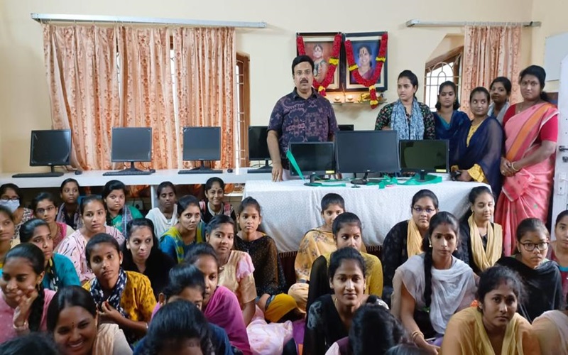 teaching computer classes to the students